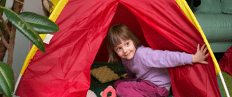 child playing in tent