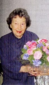 Photo of a woman called Marjorie Boxall holding flowers