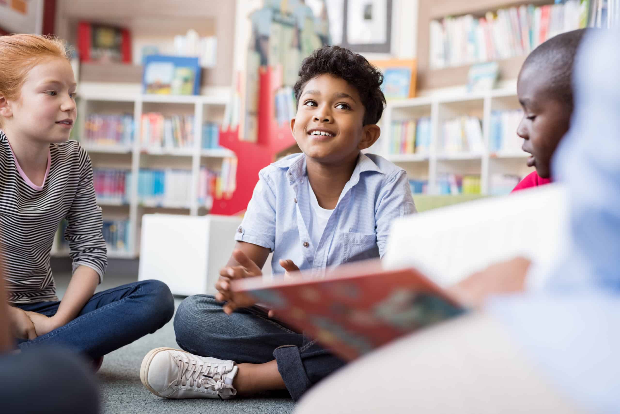 Children sitting on the floor reading books