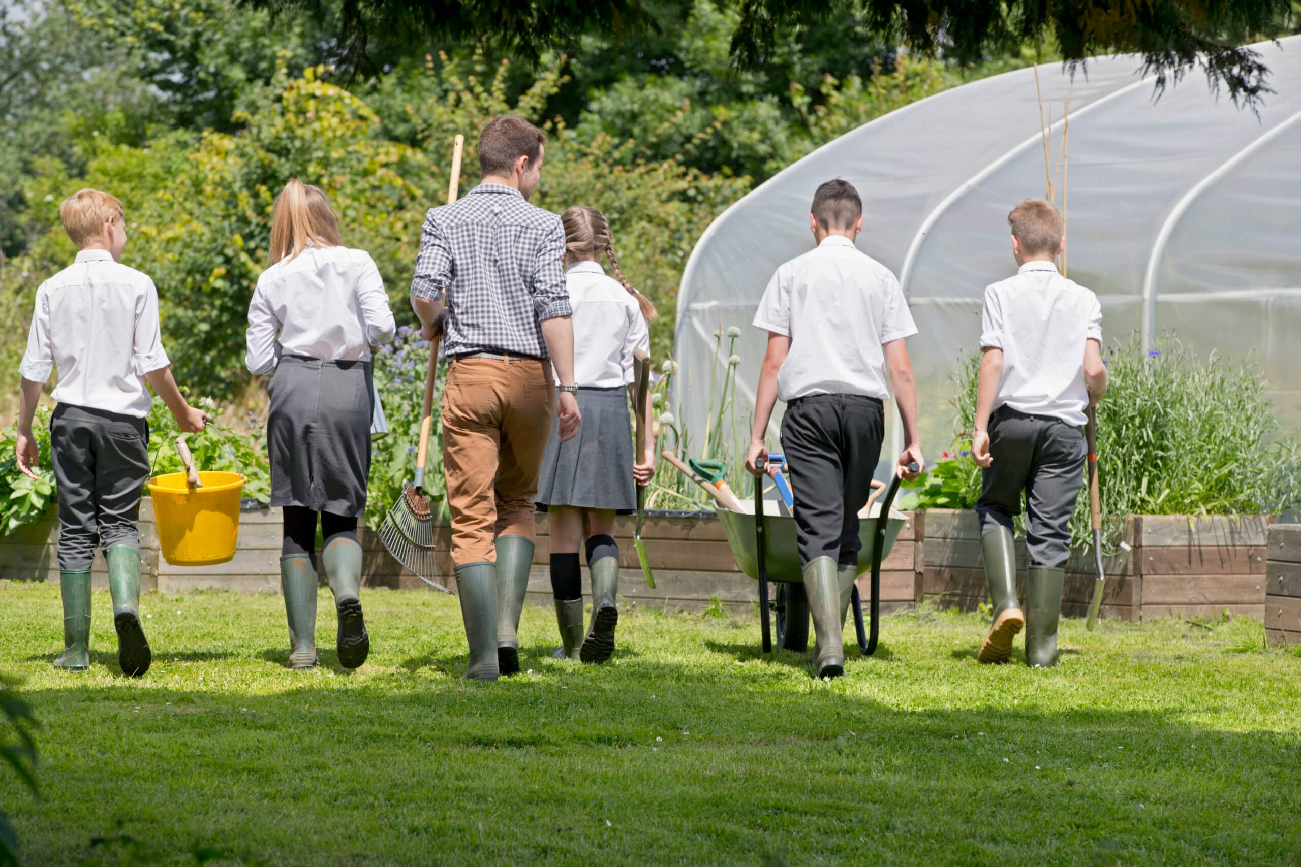 Group of secondary school children gardening