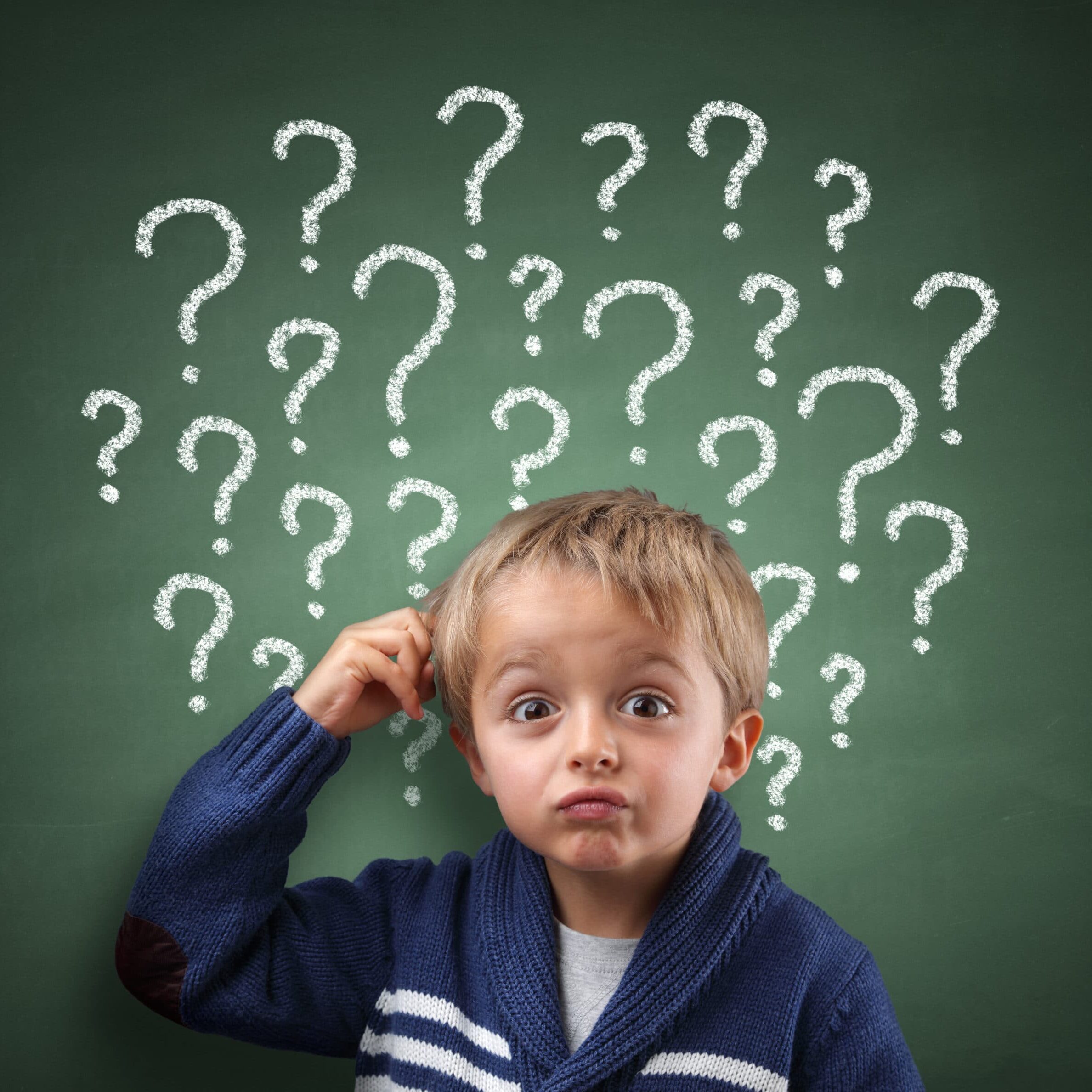 boy scratching head with question marks above him